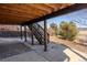 View from under the deck, looking out at the spacious backyard and adjacent open space at 4695 Bobolink Dr, Castle Rock, CO 80109