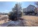 Spacious backyard featuring a fire pit and direct access to the open space at 4695 Bobolink Dr, Castle Rock, CO 80109