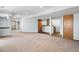 Large finished basement with new carpet offers a flexible space for recreation and entertaining at 4695 Bobolink Dr, Castle Rock, CO 80109