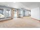 Light filled finished basement with neutral paint, carpet and multiple windows at 4695 Bobolink Dr, Castle Rock, CO 80109