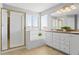 Bright bathroom features a separate shower and tub with tiled surround and double sink vanity at 4695 Bobolink Dr, Castle Rock, CO 80109