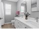 Bathroom featuring dual sinks, vanity with storage and natural light at 4695 Bobolink Dr, Castle Rock, CO 80109