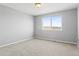 Bedroom with neutral carpet, gray walls and view of the surrounding area at 4695 Bobolink Dr, Castle Rock, CO 80109