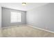 Bright bedroom with neutral carpet, gray walls and a window at 4695 Bobolink Dr, Castle Rock, CO 80109