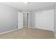 Spacious bedroom with carpet, neutral walls and double door closets at 4695 Bobolink Dr, Castle Rock, CO 80109