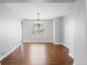 Formal dining room with hardwood floors and a chandelier. The large window lets in plenty of light at 4695 Bobolink Dr, Castle Rock, CO 80109