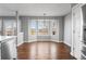 Bright dining room with hardwood floors, bay window and backyard views at 4695 Bobolink Dr, Castle Rock, CO 80109