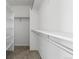 Spacious walk-in closet with multiple shelves and rods for optimal storage and organization at 4695 Bobolink Dr, Castle Rock, CO 80109