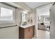 Updated bathroom with modern vanity, sink, and fixtures near a sunny window at 33477 Valley View Dr, Evergreen, CO 80439