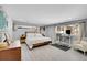 Spacious bedroom with a modern bed, a dedicated workspace, and natural light at 33477 Valley View Dr, Evergreen, CO 80439