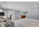 Large bedroom featuring a dedicated workspace, natural light, and light gray walls at 33477 Valley View Dr, Evergreen, CO 80439