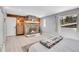 Charming bedroom featuring a fireplace, wood accents, and a scenic view from the window at 33477 Valley View Dr, Evergreen, CO 80439
