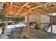 Spacious deck area with log beam ceiling connects the home to the natural surroundings and outdoors at 33477 Valley View Dr, Evergreen, CO 80439