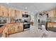 Spacious kitchen with modern appliances, breakfast table, and ample countertop space for food preparation at 33477 Valley View Dr, Evergreen, CO 80439
