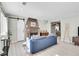 Bright living room featuring a stone fireplace, hardwood floors, and stylish furnishings at 33477 Valley View Dr, Evergreen, CO 80439