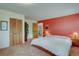 Inviting bedroom with rich accent wall and well-lit interior at 28858 Richmond Hill Rd, Conifer, CO 80433