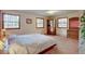 Bright bedroom with multiple windows and classic wood furniture at 28858 Richmond Hill Rd, Conifer, CO 80433
