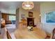 Comfortable dining room area with cozy fireplace and view of the living room at 28858 Richmond Hill Rd, Conifer, CO 80433
