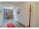 Open foyer with tiled floors, sky light and coat rack at 28858 Richmond Hill Rd, Conifer, CO 80433