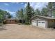 This charming home features a detached two-car garage and a serene wooded setting, offering peace and privacy at 28858 Richmond Hill Rd, Conifer, CO 80433