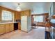 Kitchen featuring natural wood cabinets and adjacent eat-in kitchen at 28858 Richmond Hill Rd, Conifer, CO 80433