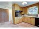 Functional kitchen with wooden cabinets and countertop space at 28858 Richmond Hill Rd, Conifer, CO 80433