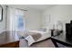 Well-lit bedroom with cozy bed, window, and desk, perfect for relaxation or study at 9750 Taylor River Cir, Littleton, CO 80125