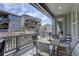Inviting covered patio with outdoor seating and views of the surrounding neighborhood at 9750 Taylor River Cir, Littleton, CO 80125