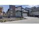 Modern home exterior with stone accents, stylish siding, two-car garage, and landscaped front yard at 9750 Taylor River Cir, Littleton, CO 80125