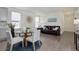 Inviting open-concept living and dining area with stylish decor and natural light at 9750 Taylor River Cir, Littleton, CO 80125