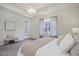 Spacious main bedroom featuring a window, a door leading to the yard and a seating area at 9750 Taylor River Cir, Littleton, CO 80125