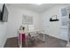 Well-lit home office with a modern desk, comfortable chair, and warm wood floors at 9750 Taylor River Cir, Littleton, CO 80125