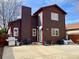 Exterior rear elevation featuring a barbecue, a bicycle, and a concrete patio at 363 Wadsworth Cir, Longmont, CO 80504