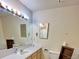 Modest bathroom with a sink, toilet, and bathtub with tiled walls at 363 Wadsworth Cir, Longmont, CO 80504