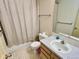 Modest bathroom featuring a shower and tub, a standard toilet, and vanity with natural lighting at 363 Wadsworth Cir, Longmont, CO 80504