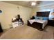 Bedroom showcasing a queen bed with a dark wood frame and soft blue pillows at 363 Wadsworth Cir, Longmont, CO 80504