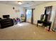 Bedroom featuring neutral walls and decor, a window with curtains, a black dresser, and vanity at 363 Wadsworth Cir, Longmont, CO 80504