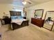 A primary bedroom featuring a queen bed, dresser, and a full-length mirror at 363 Wadsworth Cir, Longmont, CO 80504