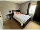 Cozy bedroom setup featuring a black bed frame and a natural-light-filled window at 363 Wadsworth Cir, Longmont, CO 80504