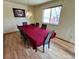 Bright dining room with large window and a large table at 363 Wadsworth Cir, Longmont, CO 80504