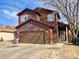 Charming two-story house featuring a spacious two-car garage and well-maintained lawn at 363 Wadsworth Cir, Longmont, CO 80504