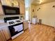 Inviting kitchen featuring appliances and an adjacent dining area at 363 Wadsworth Cir, Longmont, CO 80504