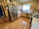 Functional kitchen featuring stainless steel appliances, wood floors and ample counter space at 363 Wadsworth Cir, Longmont, CO 80504