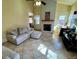 Bright living room featuring tile floors, neutral paint, fireplace, and plenty of natural light at 363 Wadsworth Cir, Longmont, CO 80504