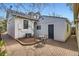 Backyard patio with brick pavers, seating area, and access to the home at 347 Bannock St, Denver, CO 80223