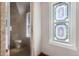 Unique bathroom with a shower and stained glass window, showing modern design at 347 Bannock St, Denver, CO 80223