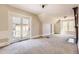 Spacious bedroom featuring carpeted floors, fireplace, and exterior balcony, showcasing classic design at 347 Bannock St, Denver, CO 80223