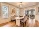 Dining room with hardwood floors, a vintage table, and beautiful stained-glass windows at 347 Bannock St, Denver, CO 80223