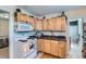 Functional kitchen featuring wood cabinets and modern appliances for convenient cooking at 347 Bannock St, Denver, CO 80223