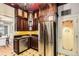 Stylish kitchen with stainless steel appliances and unique pantry door at 347 Bannock St, Denver, CO 80223